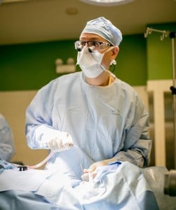 Dr Alan Harvey perfoming oral surgery
